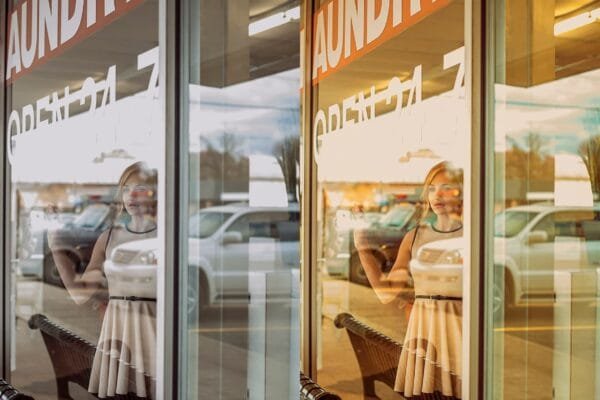 girl behind window with a summer lightroom preset