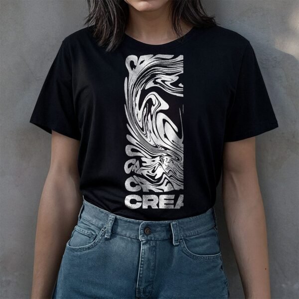 woman wearing a black t-shirt stand behind a concrete wall