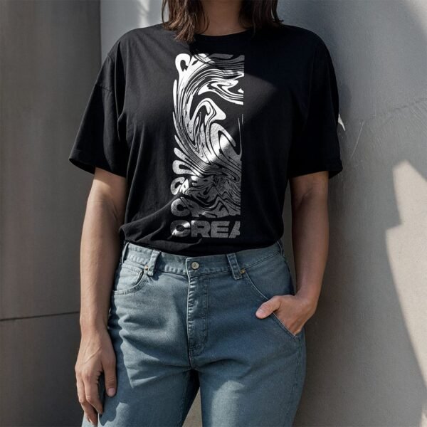 woman wearing a black t-shirt stand behind a concrete wall