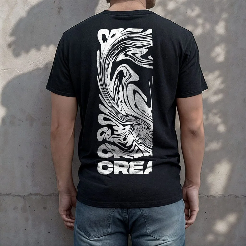 Back of a Man wearing a black t-shirt stand behind a concrete wall