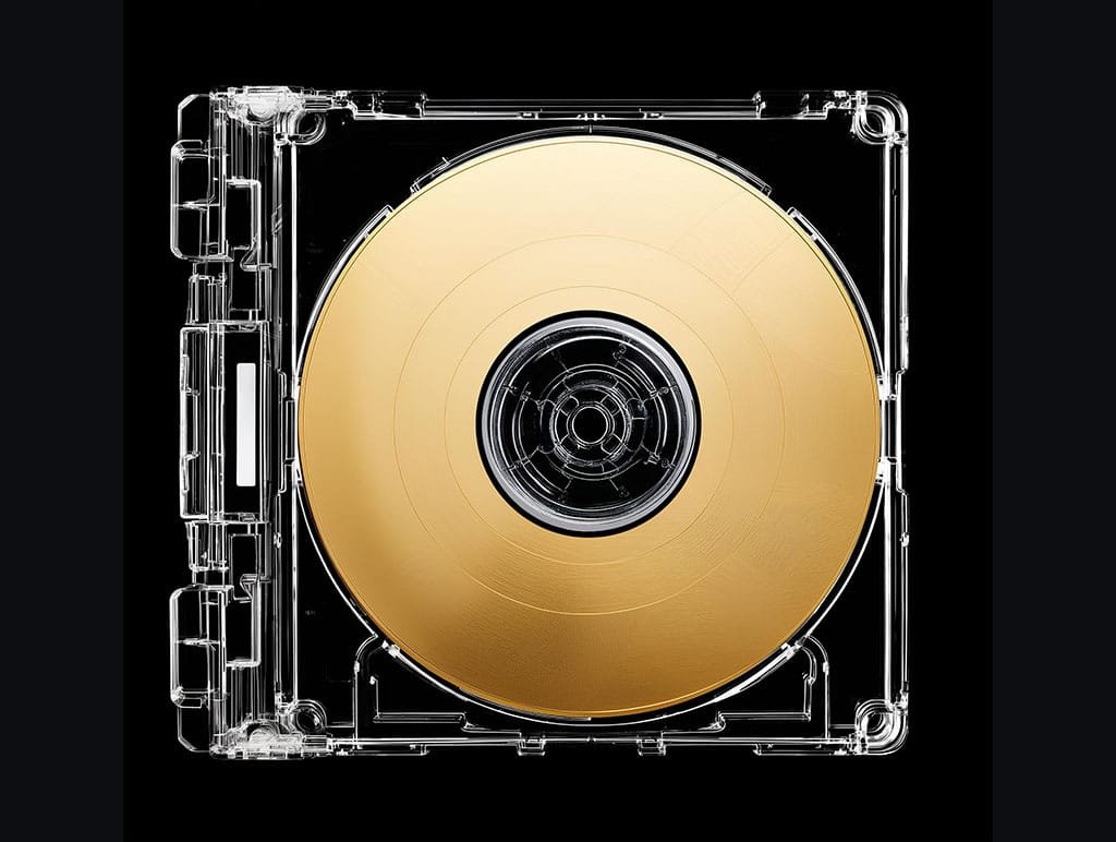 Clear CD Case Mockup with a golden compact disk inside, black background