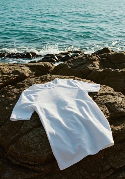 Blank t-shirt mockup on seaside rock