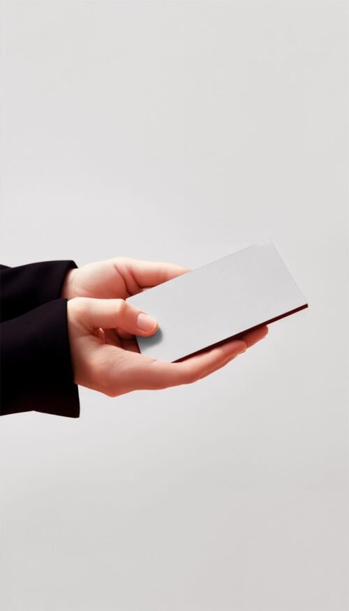 Hands holding a blank business card mockup
