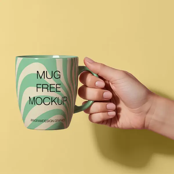 Woman's hand holding a coffee mug mockup