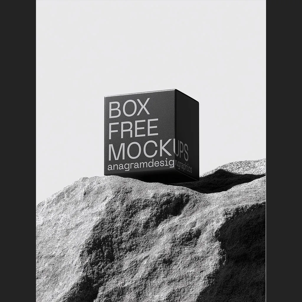 Square Box on a grey rock with hard shadows
