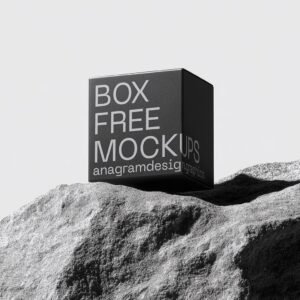 Square Box on a grey rock with hard shadows