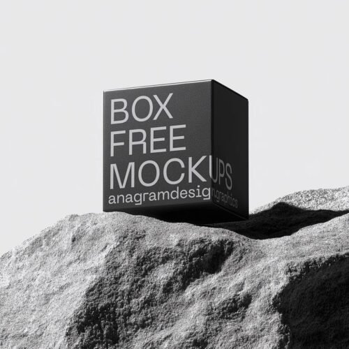 Square Box on a grey rock with hard shadows
