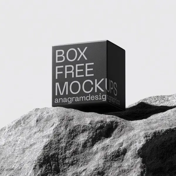 Square Box on a grey rock with hard shadows