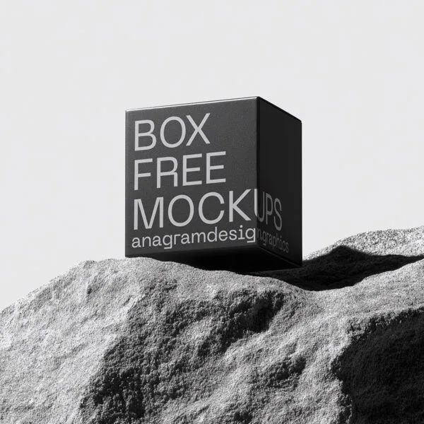 Square Box on a grey rock with hard shadows