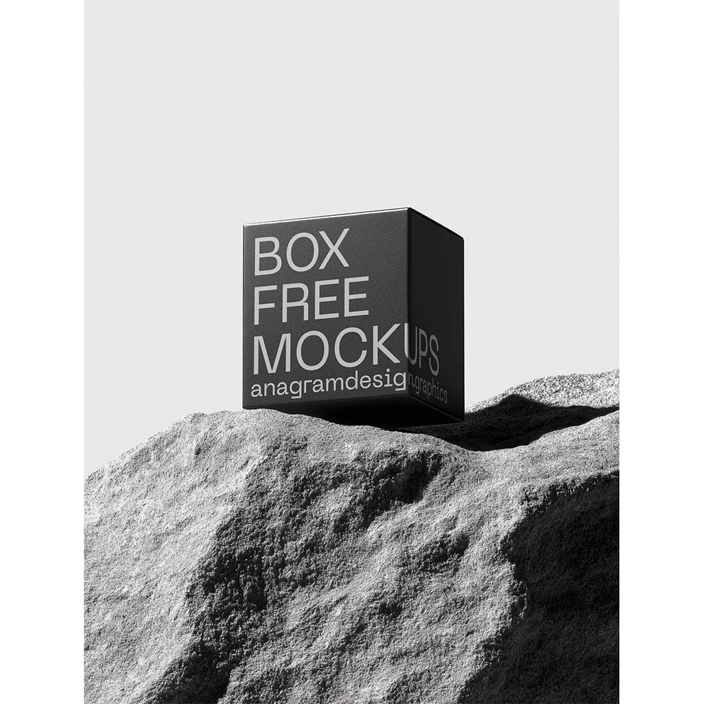 Square Box on a grey rock with hard shadows