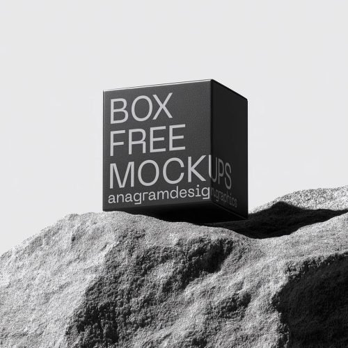 Square Box on a grey rock with hard shadows