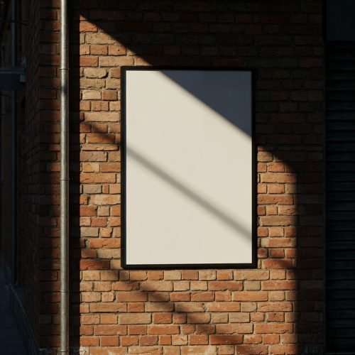 Poster on a brick wall, sunlight shadows