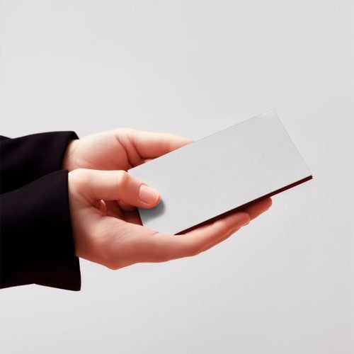 Hands holding a blank business card mockup
