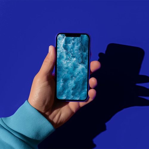 hand holding an iPhone, free Mockup